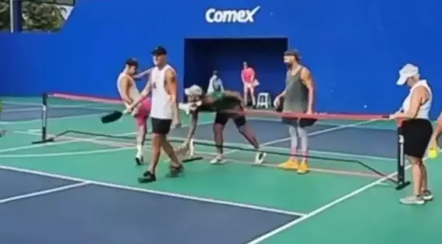 The athlete who lost the match kicked his opponent in the face.