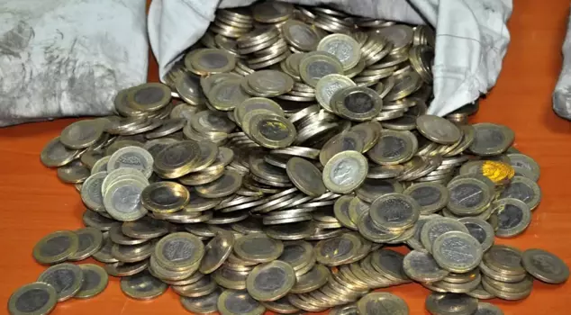 He turned the corner with these coins in his pocket.