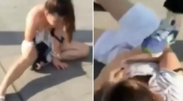 She brutally beat her husband's mistress in the middle of the street and tore her clothes.