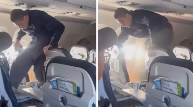 A passenger who was trying to break the airplane seat by kicking it was subdued by other passengers.