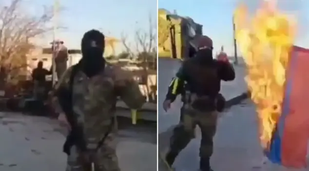 The opposition soldier who took down the Russian flag at Aleppo Airport: They ran away like dogs from here.