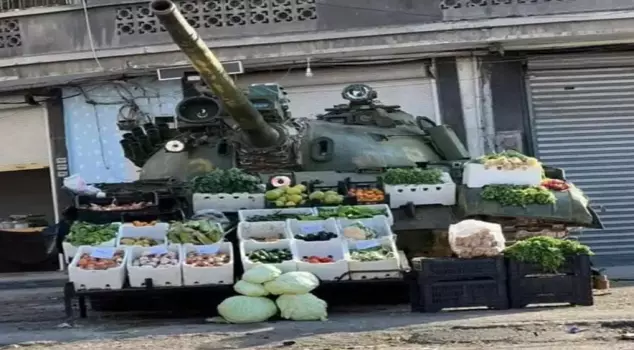 In Syria, an abandoned tank has become a fruit and vegetable stand.