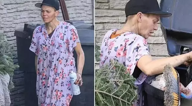 The homeless former model was seen searching for belongings in a trash container.