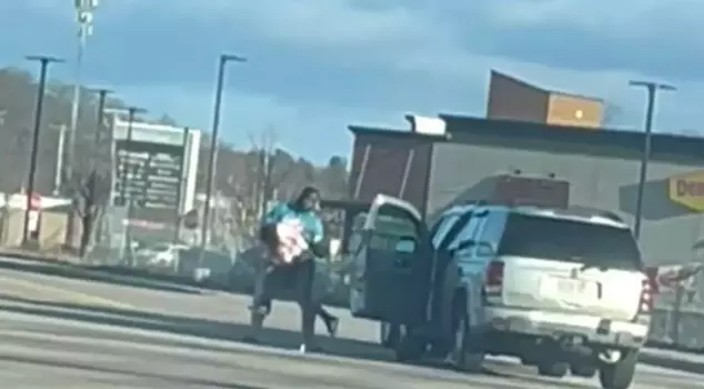 The former football player lifted the mother of two children into the air and threw her to the ground during a road rage incident.