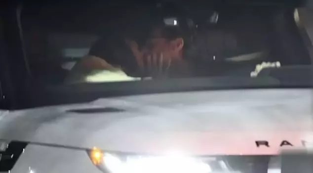 The famous couple, whose relationship emerged last week, was spotted kissing in a car.