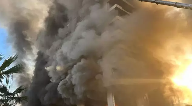 The workers were rescued from amidst the flames like this.