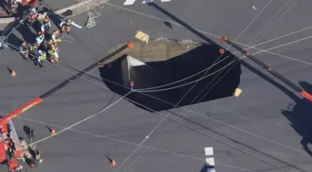 In Japan, the road collapsed, and a truck fell into a giant pit.