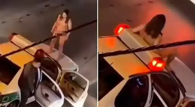 An interesting protest in Iran: A woman climbed onto a police vehicle naked.