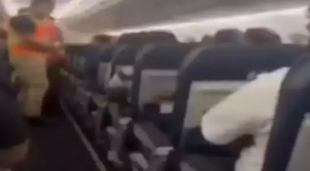 A passenger brandishing a weapon on the plane caused panic: 