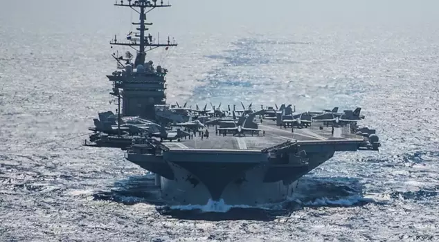 A U.S. Navy aircraft carrier collided with a cargo ship in the Red Sea.