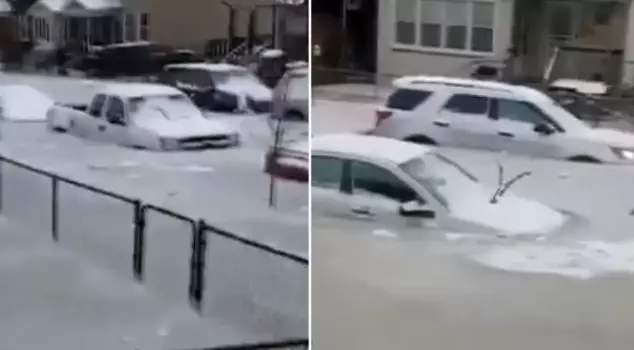 A century-old water pipe burst in Detroit, leaving vehicles stranded in the frozen water.