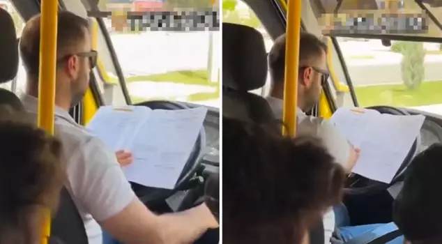 The minibus driver studied while driving.