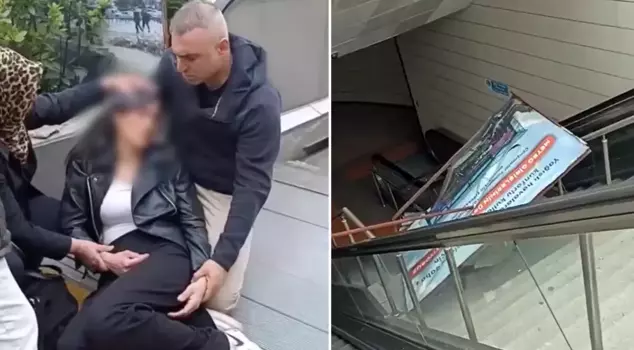 The advertisement board fell on the young woman at the escalators in the metro station.