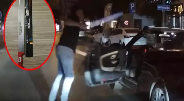 The driver who approached the motorcyclist with a switchblade has been arrested.
