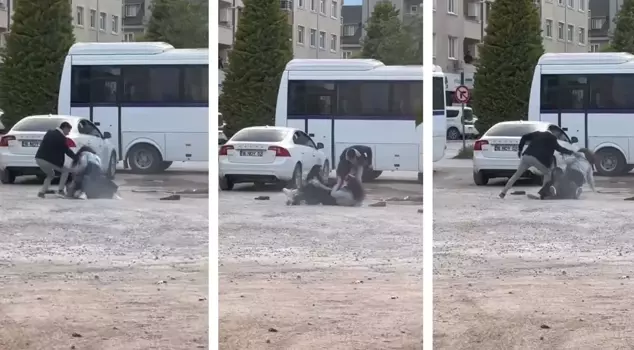 Two young girls fought fist to fist in the parking lot.