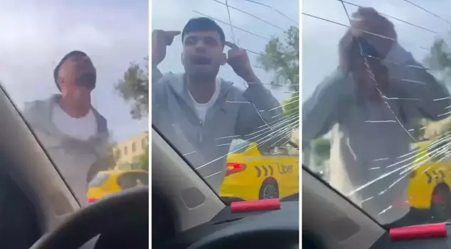 The taxi driver, who was having a nervous breakdown, hit himself and broke the car's window.