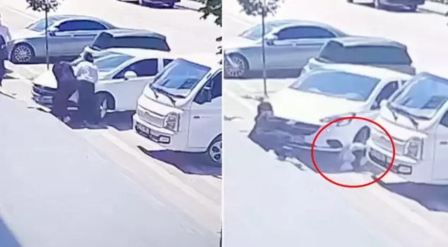 The driver ran over the high school student while parking the car.