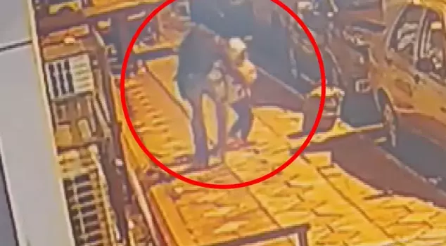 He tried to abduct the little girl next to her father.
