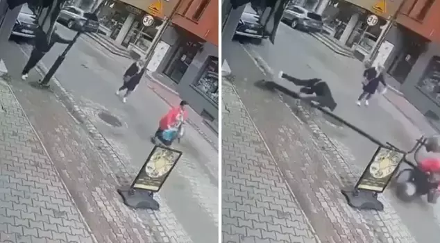 While talking on the phone, the street lamp he was leaning on fell on a woman.