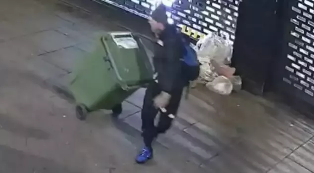 The brazen thief stole thousands of dollars worth of clothing with a trash can.