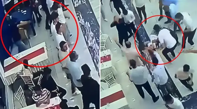 The moment of the armed attack in the wedding hall captured on security camera.