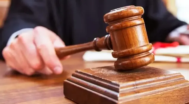 The Council of State judge was shot in the head.