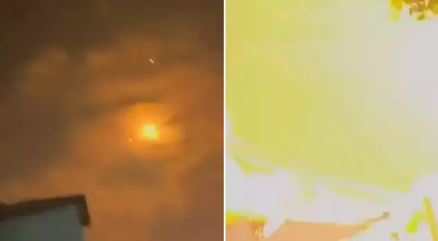 The missiles fired from Iran landed near the Israeli who was recording.