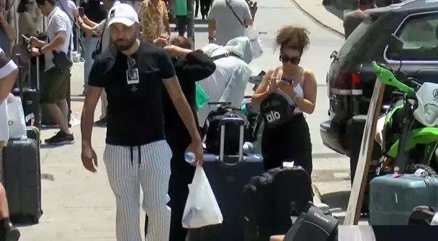 Iranians living in Istanbul are returning to their country by bus.