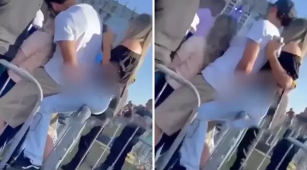 At the concert, he harassed the woman behind him while hugging his girlfriend.
