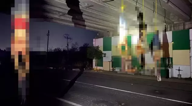 The highway has a horrific scene! They decapitated their heads and hung them on the bridge.