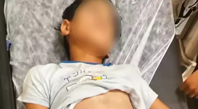 The small child was found unconscious by the roadside, and the family is being sought.