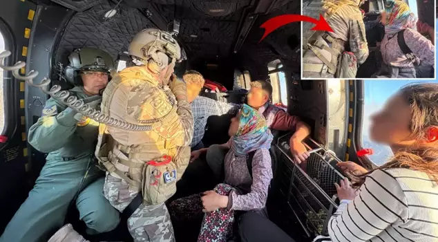 Mehmetçik rescued a family trapped in a village engulfed in flames.