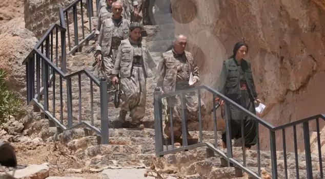 Who participated in the ceremony where the PKK's weapons were destroyed? Bese Hozat also burned her weapon.