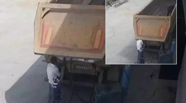 The horrific death captured on camera! The dump truck lid hit him on the head.