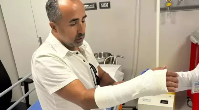 The star football player's shot broke his arm.
