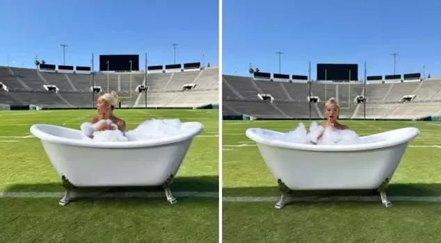 The famous female athlete posed naked in a bathtub placed on the football field.