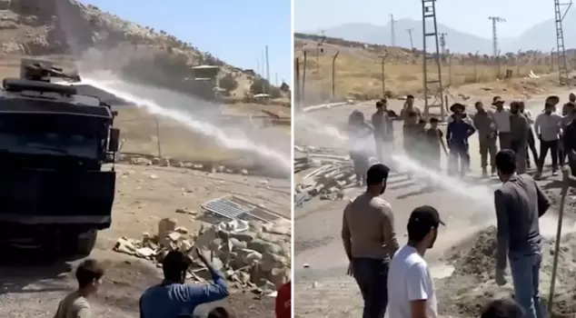 Reflections of the new era: Water cannons are now spraying water on the pavement.