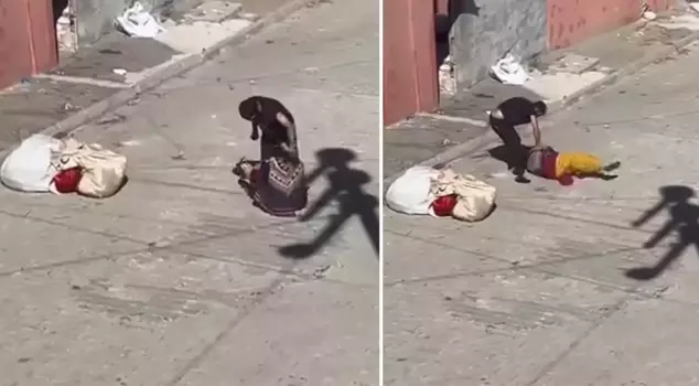 The brutal husband beat his wife in the middle of the street until she fainted.