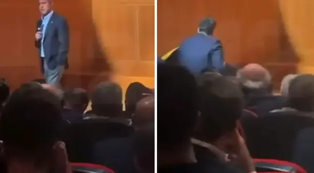 Ali Koç fell to the ground while giving a speech.