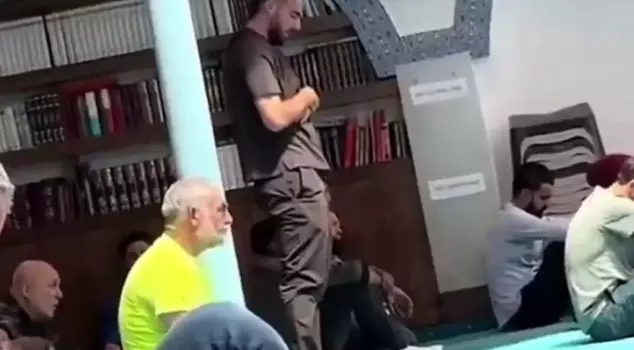 The national football player was seen praying.