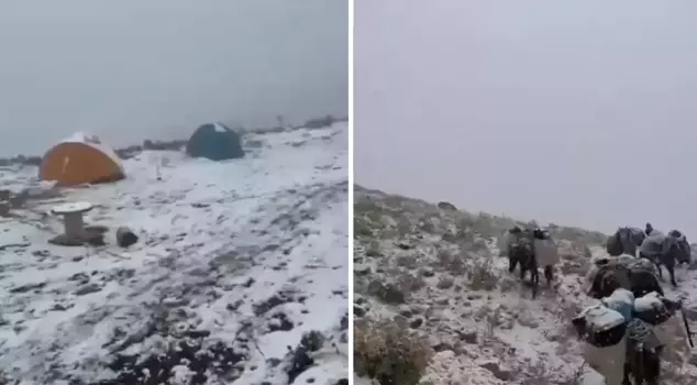 The snowfall suddenly intensified, and the climbers were stranded.