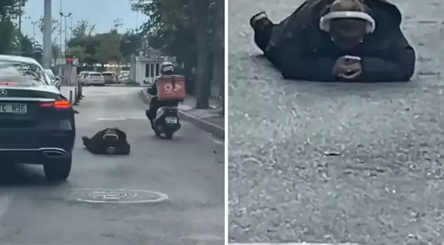 The world doesn't care! Look at what he's doing, lying in the middle of the road.