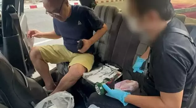 A fake doctor performing penis enlargement procedures was arrested behind his vehicle.