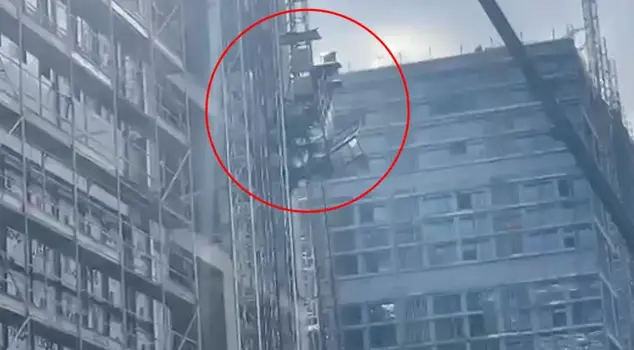The freight elevator with four construction workers fell! One worker crashed to the ground.
