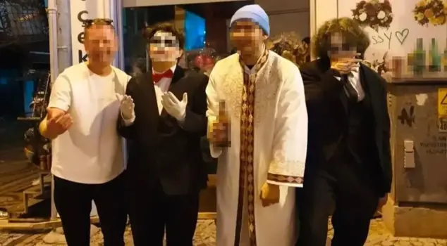 The young man, wearing an imam's robe and holding a bottle of alcohol, has been released after being the focus of reactions.