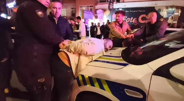 The drunk driver kicked the police officer who asked for his ID.
