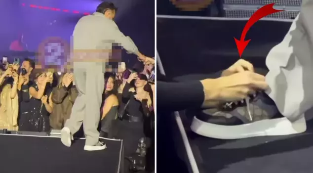 The moment that made an impression at the concert! Kenan Doğulu had a fan tie his shoelaces.