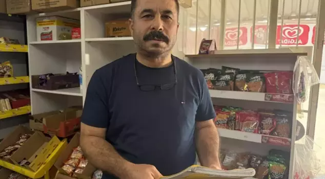 A mysterious benefactor who paid off the grocery debts of 30 people burned the credit ledger.