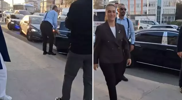 He arrived in a convoy with flashing lights, and everyone is curious about who is getting out of the vehicle.