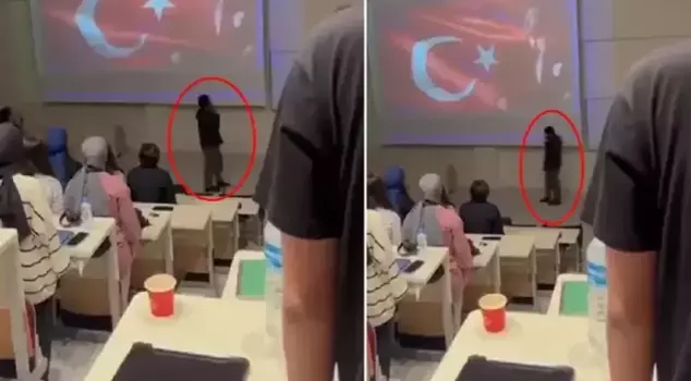 At 9:05, while everyone was standing in silence, he walked around with his phone in hand.